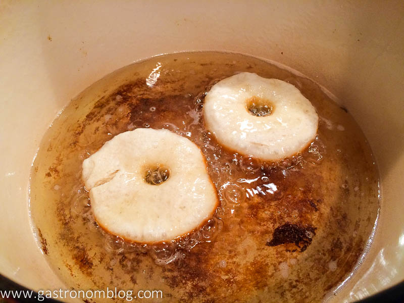 Biscuit dough doughnuts frying in oil