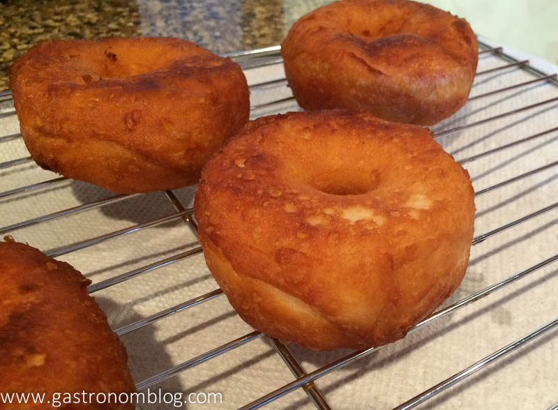 Biscuit Dough Doughnuts cooling on a cooling rack